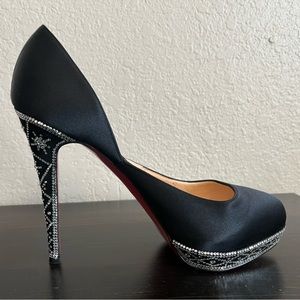 Black Christian Louboutin heel embezzled with snowflake design